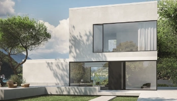 Puerta de entrada moderna en color oscuro instalada en vivienda con diseño arquitectónico actual