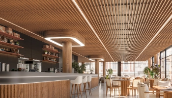 Instalación de revestimiento de techo con lamas Luxia de PVC en restaurante moderno, aportando diseño, confort y aislamiento acústico